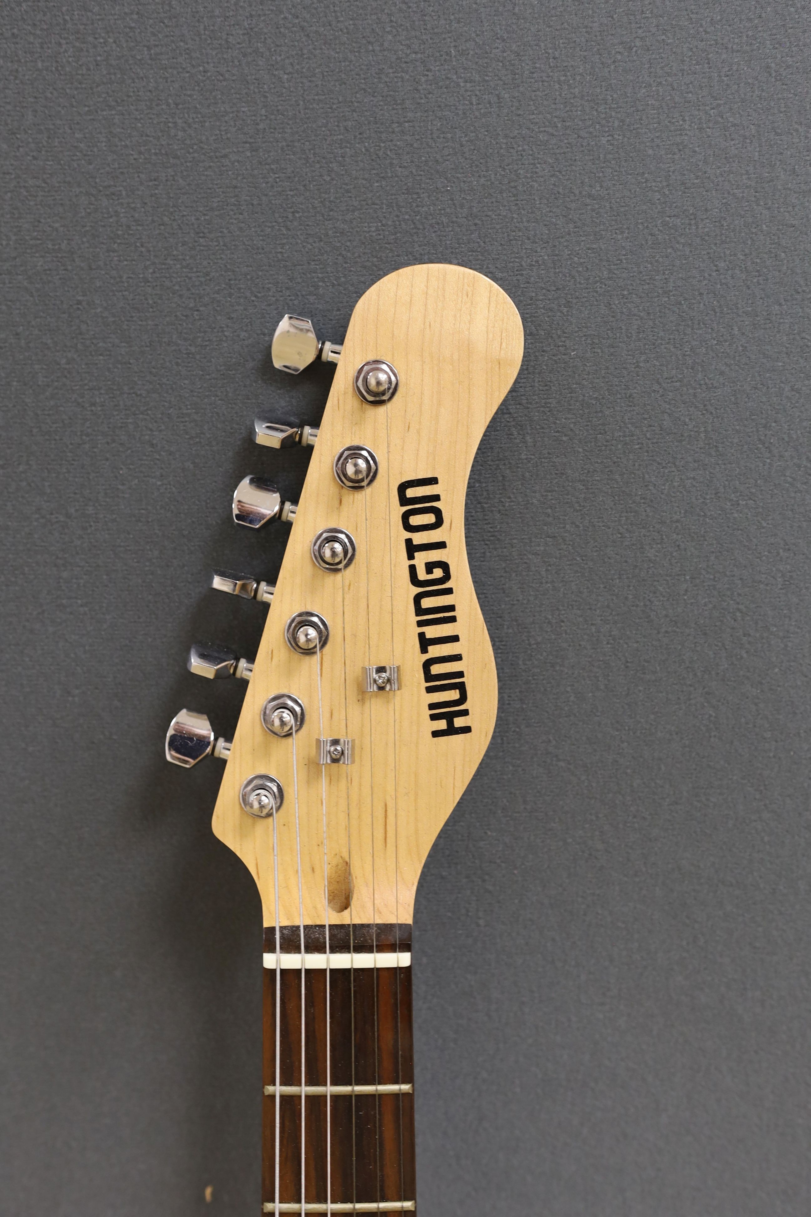 A Huntingdon electric guitar, stand not included, guitar 102 cms high.